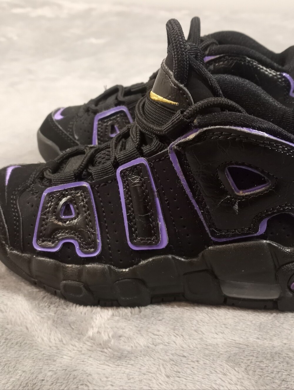 Nike Air kids More Uptempo sneakers in black with purple accents, size US 11C